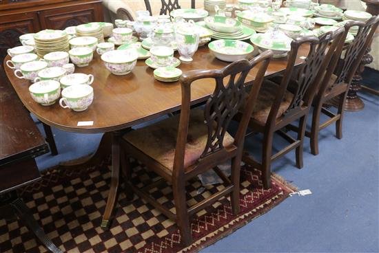 An extending twin pillar dining table, L.240cm
